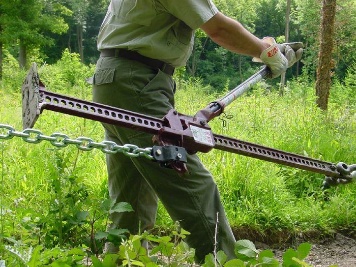 A person using a hi-lift jack as a winch